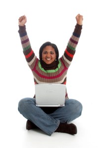 Woman with a computer on a white background