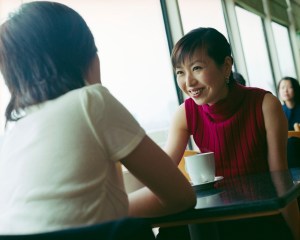 Asian Women Chatting over Coffee ca. 2002 Hong Kong, China