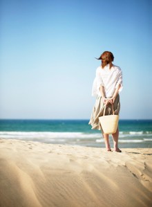 Woman on Beach Looking at Ocean --- Image by © Royalty-Free/Corbis